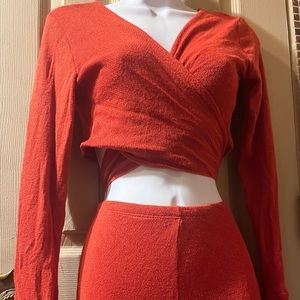 Two piece orange stretch, sarong top with bell sleeves & bell bottom pants